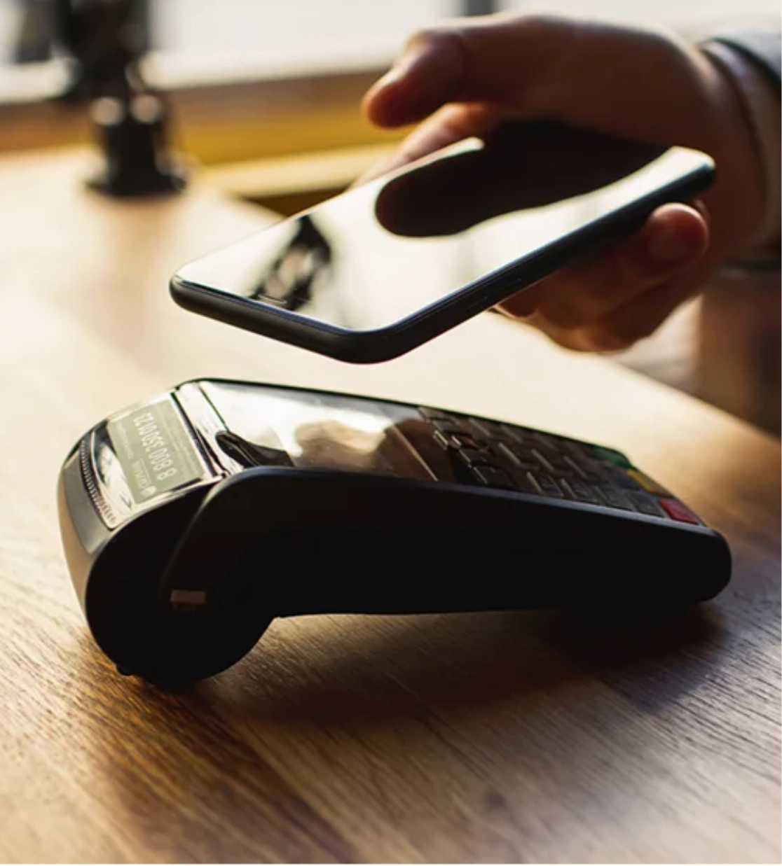 Hand scanning phone on digital scanner